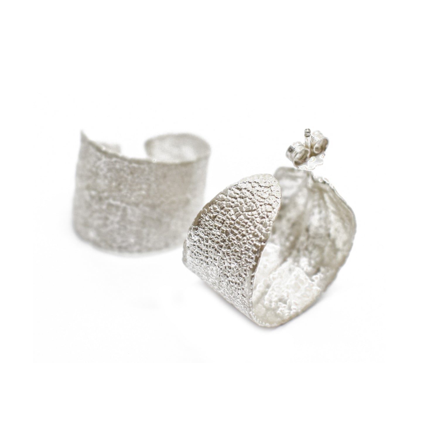 Sterling silver hoop earrings featuring real sage leaves, meticulously handcrafted in Greece, a fusion of nature's beauty and artisanal excellence.